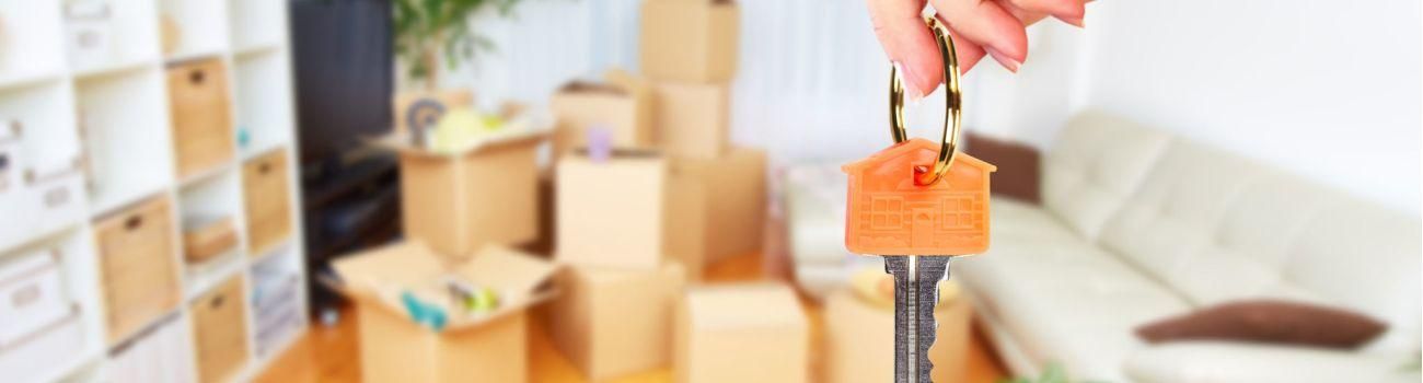 46778498 - hand with house key. real estate and moving background.