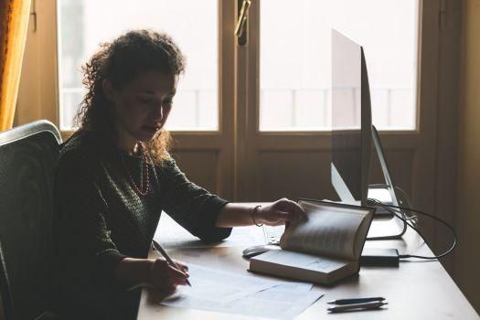35115142 - young woman working at home, small office